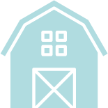 A blue barn with a white door and windows on a white background.