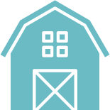A blue barn with a white door and windows on a white background.