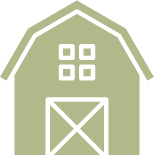 A green barn with a white door and windows on a white background.