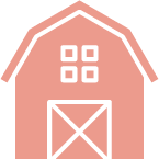 A pink barn with squares on the roof and a square door.