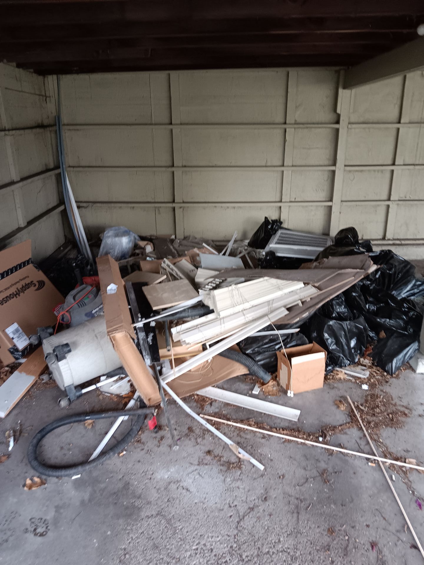 There is a lot of trash in the garage.