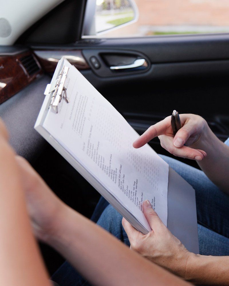 Instructor Holding Driving Test Checklist - Northgate Driving School - Rochester, MN Instructor Holding Driving Test Checklist - Northgate Driving School - Rochester, MN