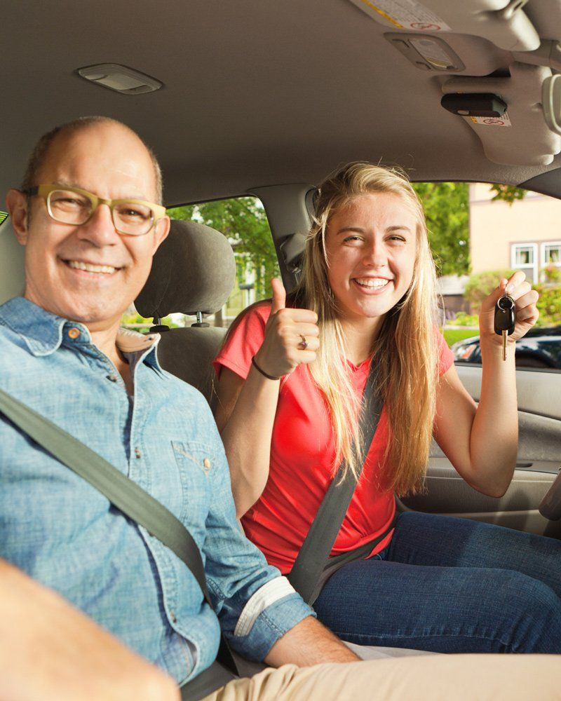 Driving Instructor and Happy Student Driver in Car - Northgate Driving School - Rochester, MN Driving Instructor and Happy Student Driver in Car - Northgate Driving School - Rochester, MN