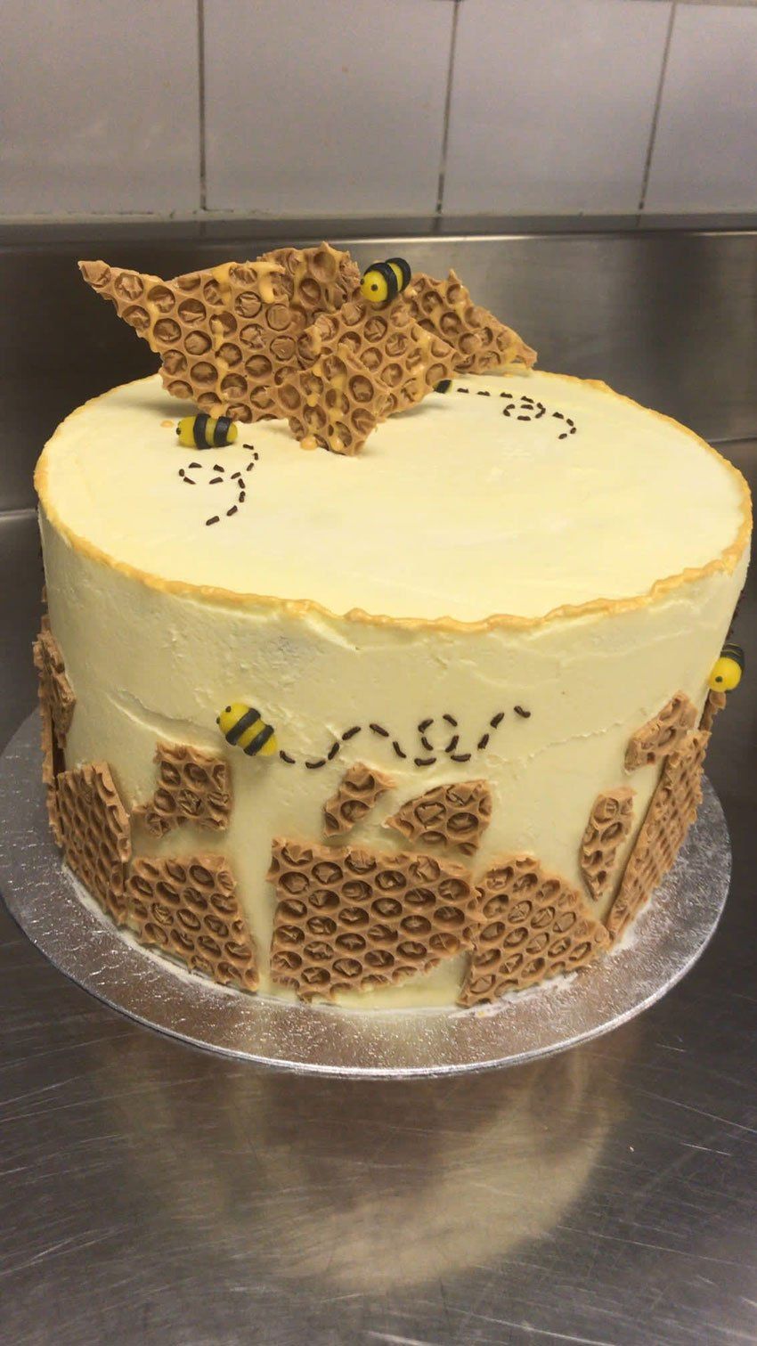 Cake with white icing and chunks of honeycomb wafer