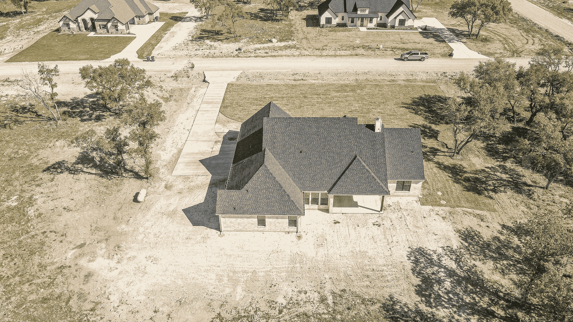 An aerial view of a house in a residential area