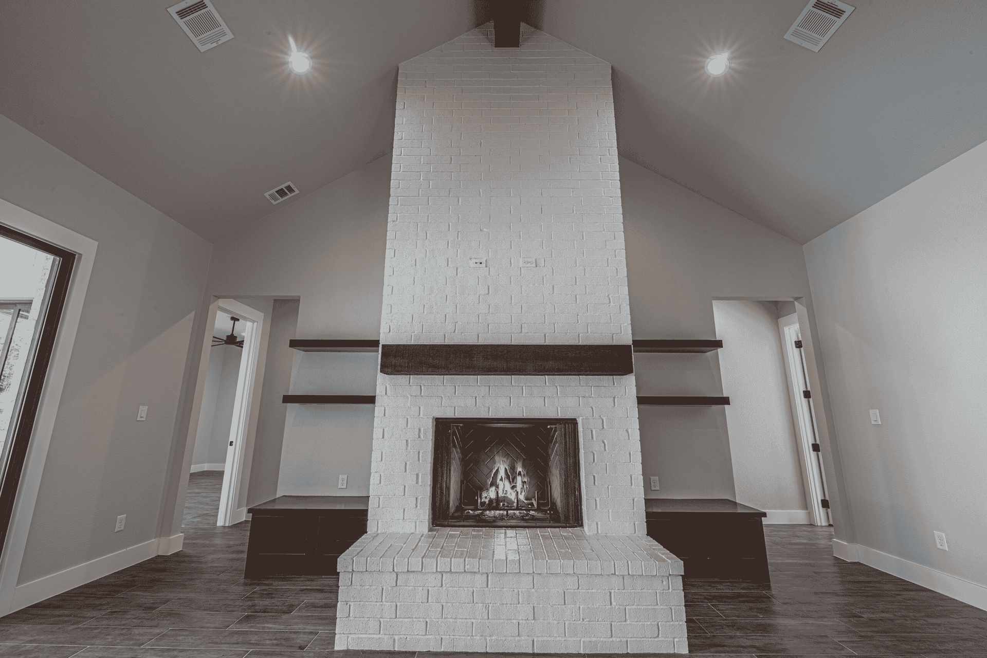 There is a fireplace in the middle of the room.