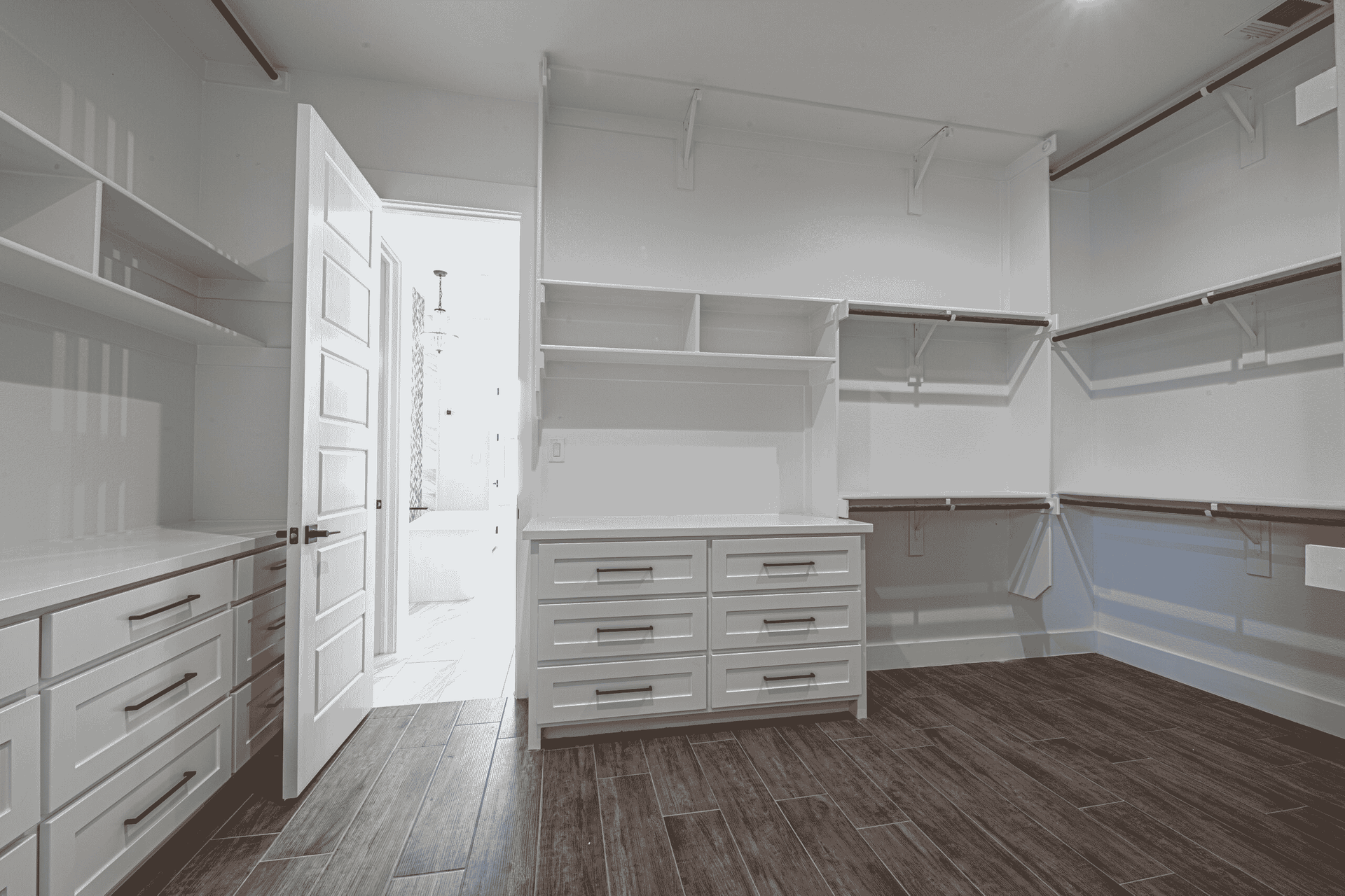 It is a walk in closet with lots of shelves and drawers.