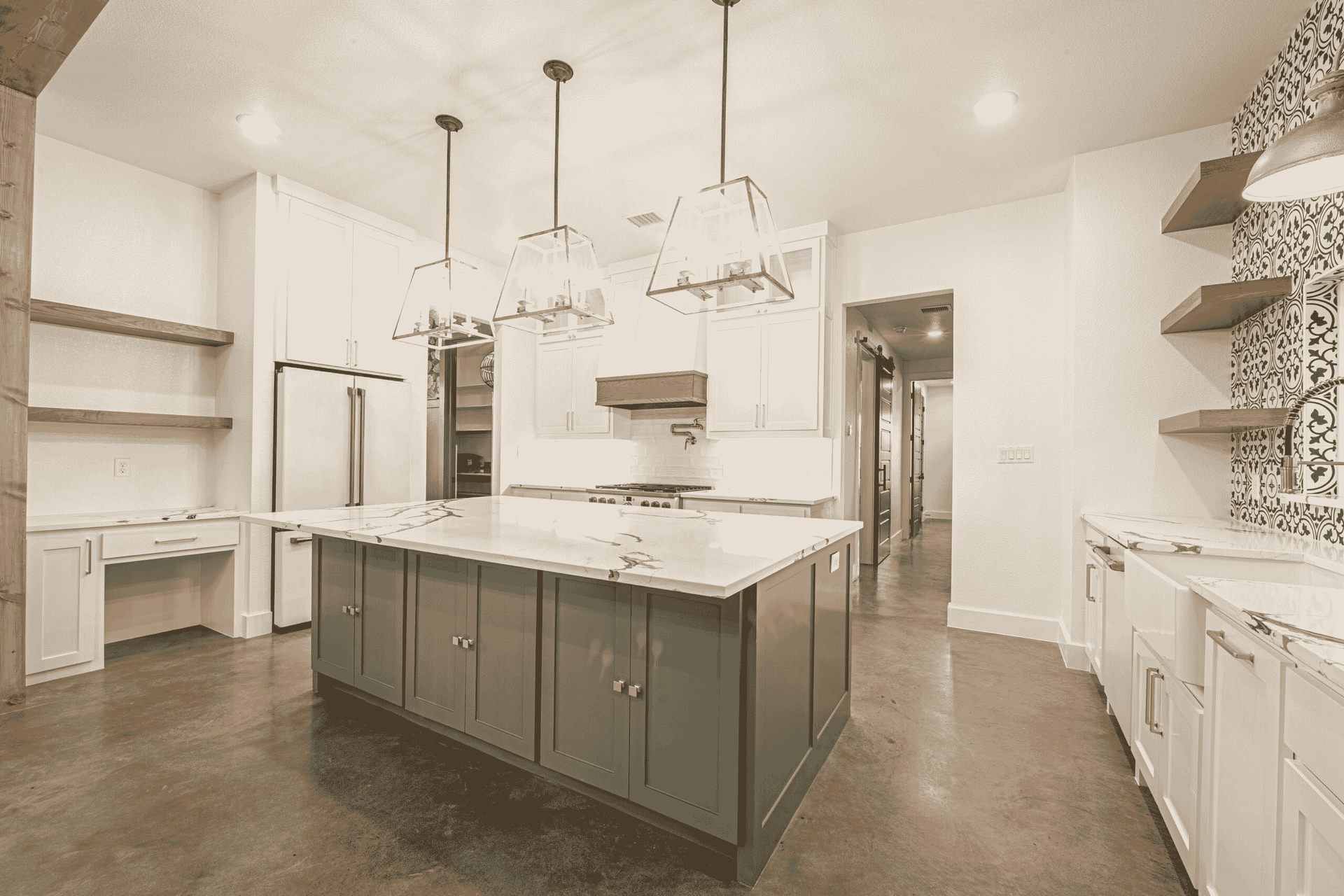 There is a large island in the middle of the kitchen.