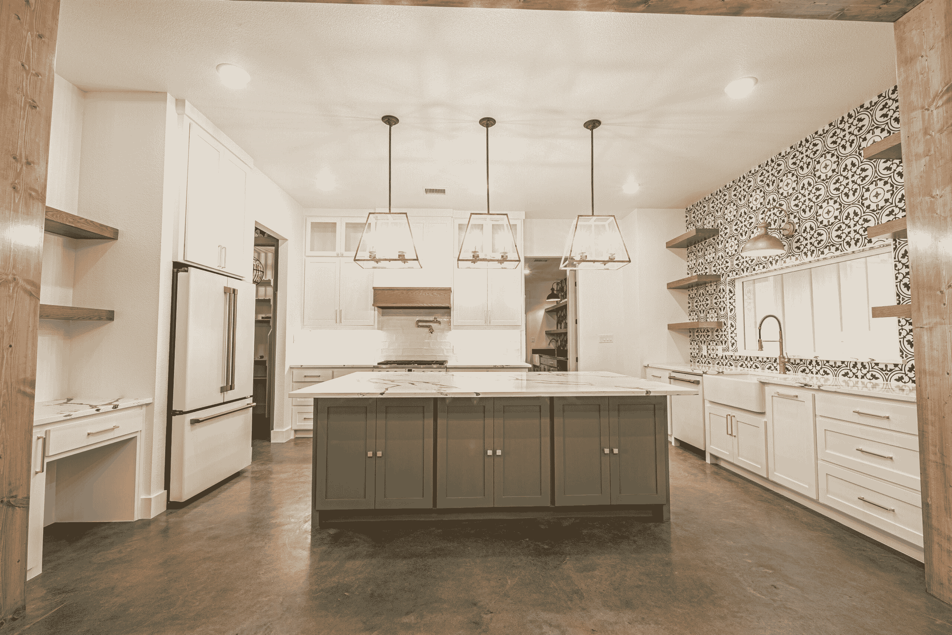There is a large island in the middle of the kitchen.