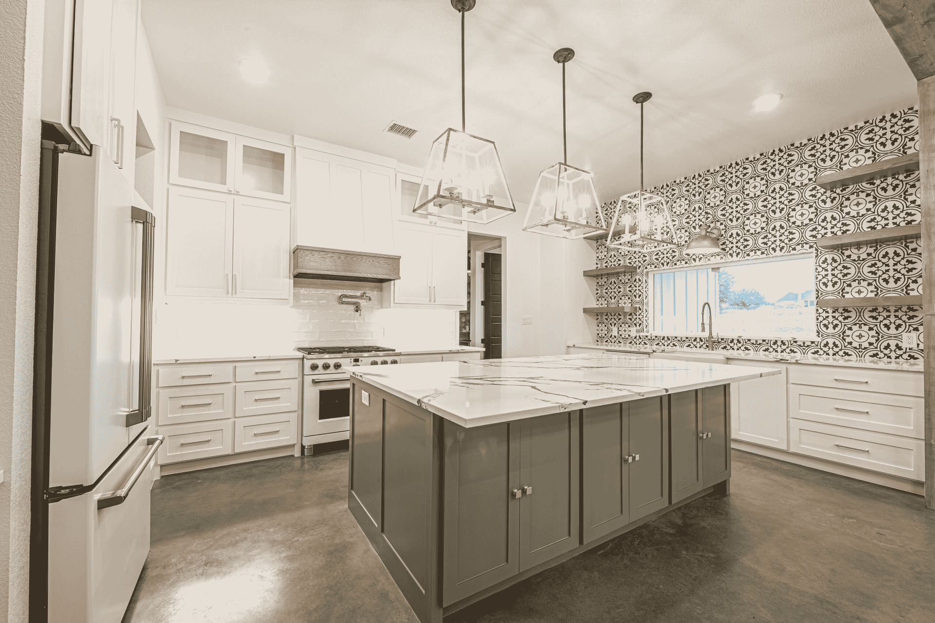 There is a large island in the middle of the kitchen.