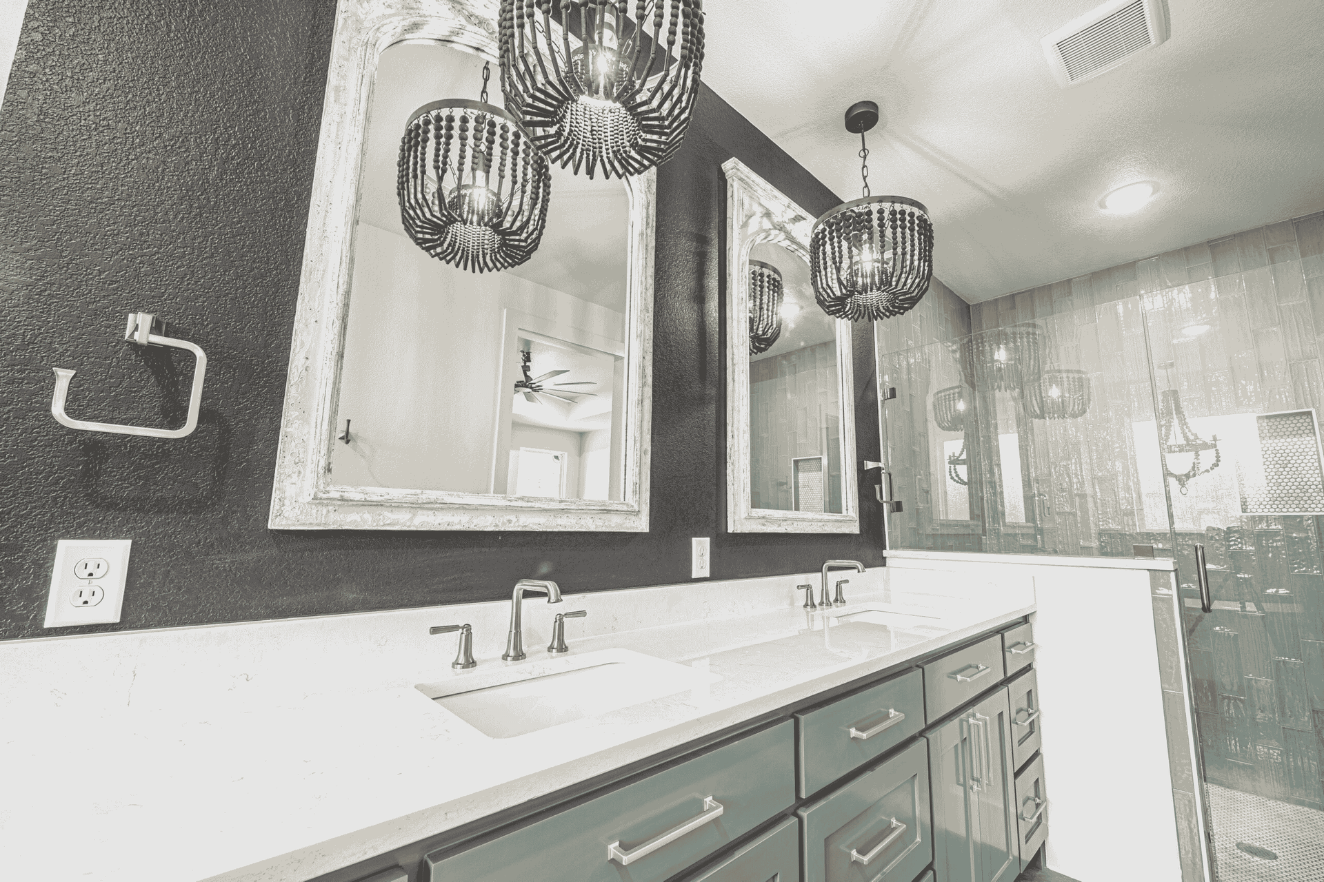 A bathroom with two sinks and two mirrors.