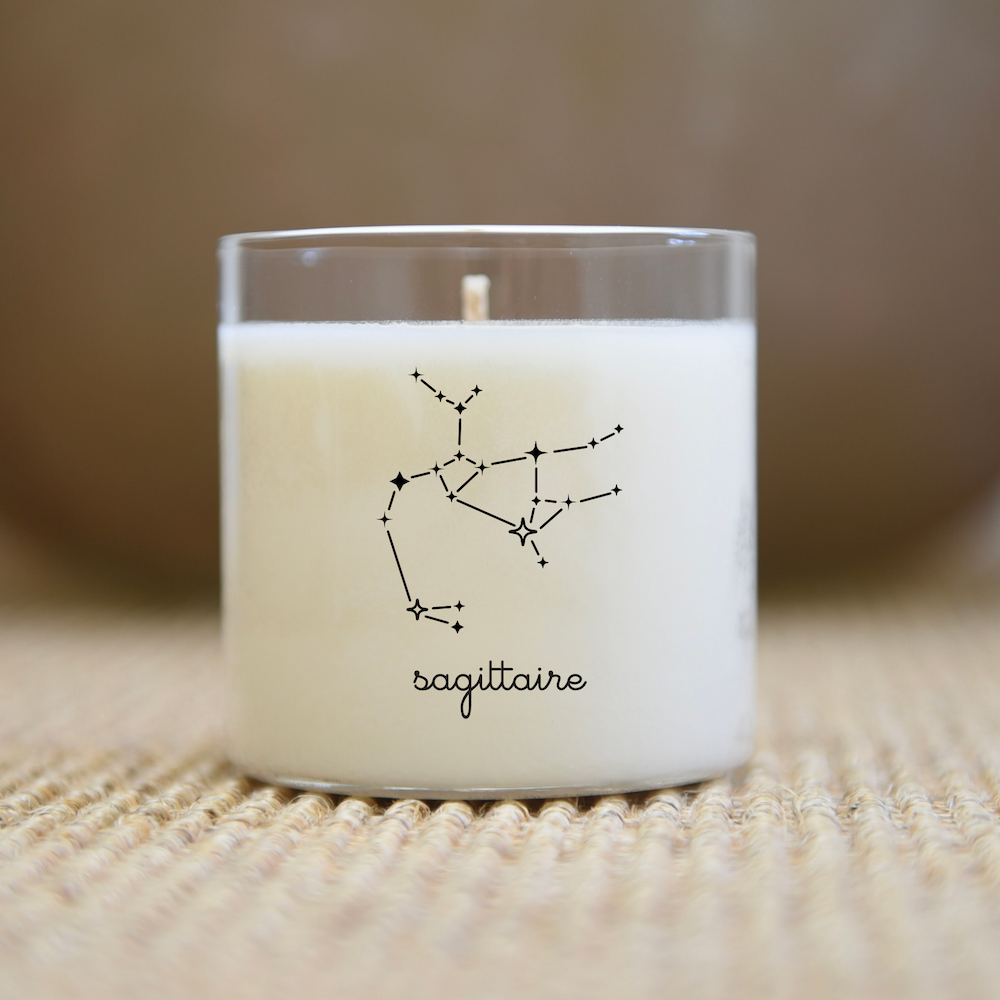 Bougie en verre avec illustration et inscription de la constellation 