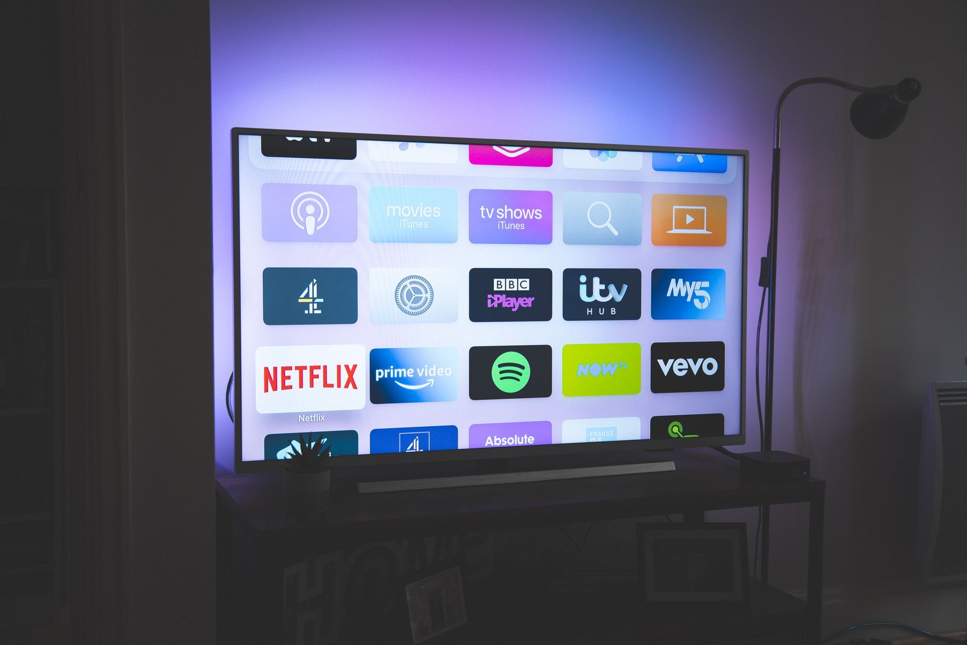 A netflix app is displayed on a flat screen tv