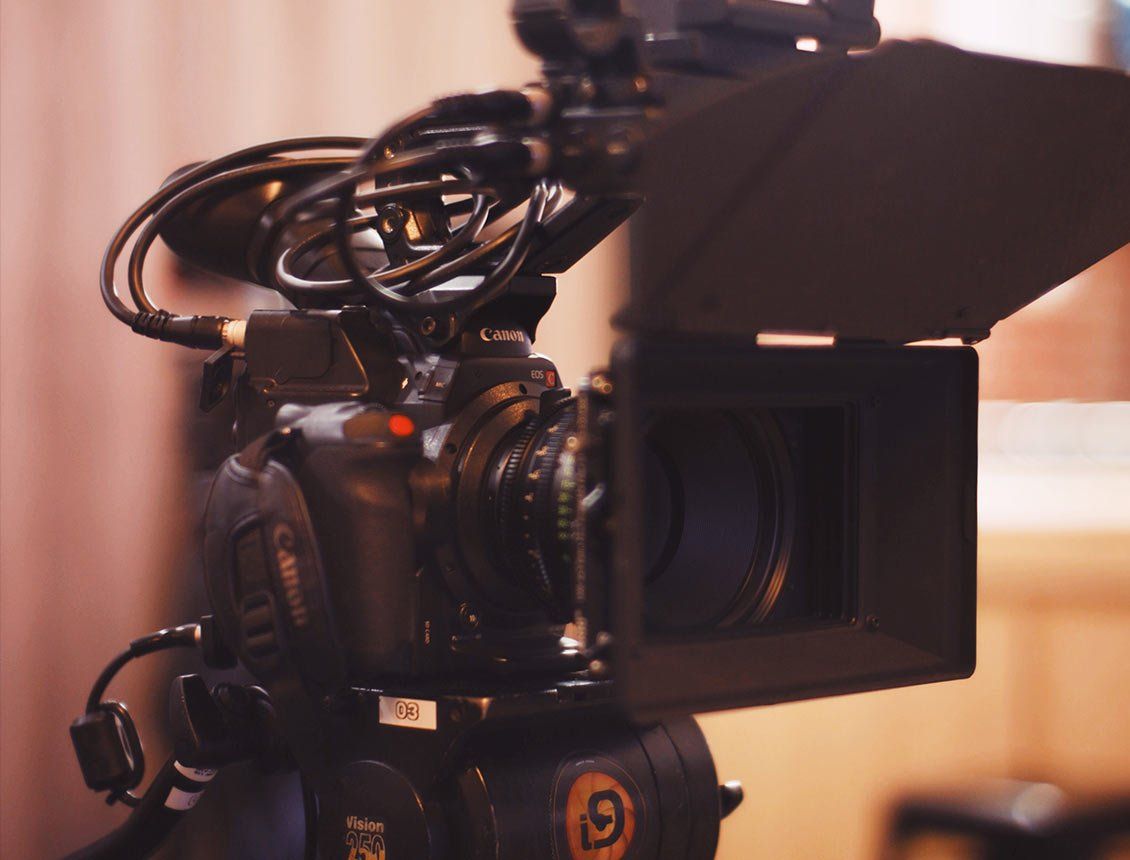 close up cannon c300 cinema camera with matte box A camera with the number 69 on it