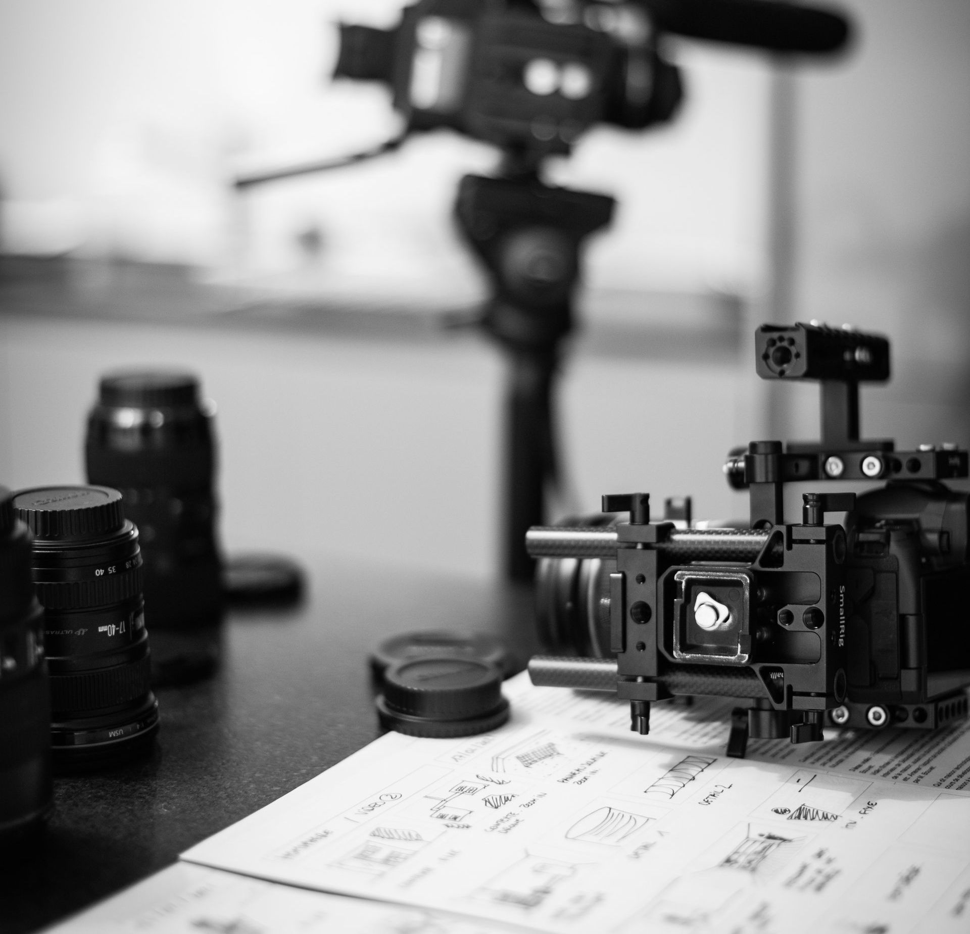 A black and white photo of a camera on a table A black and white photo of a camera on a table