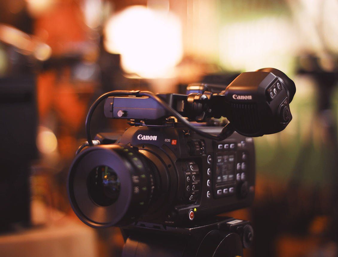 Close up canon cinema camera on tripod A close up of a video camera on a tripod.