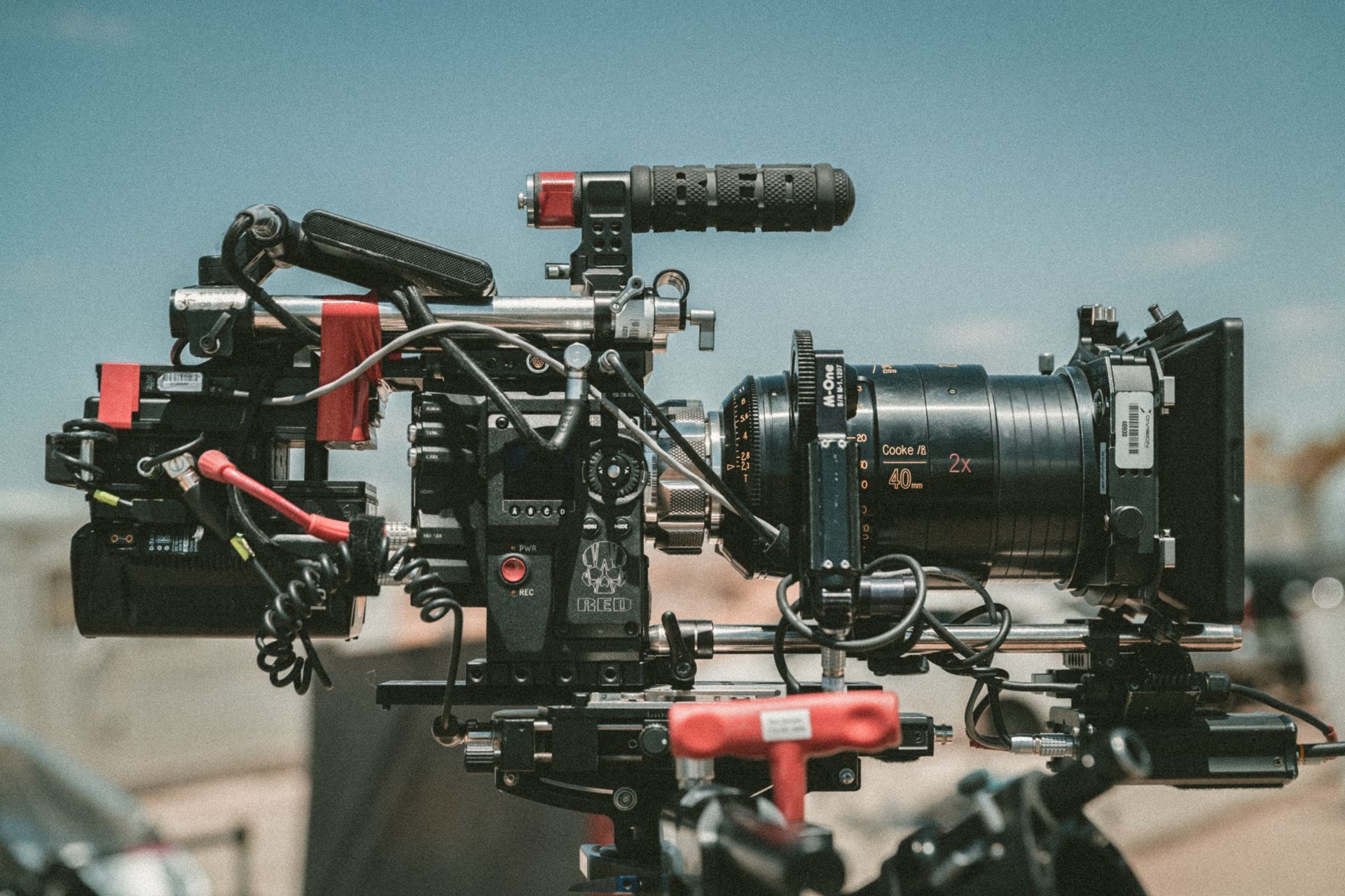 A camera with the number 8 on it is sitting on a tripod.