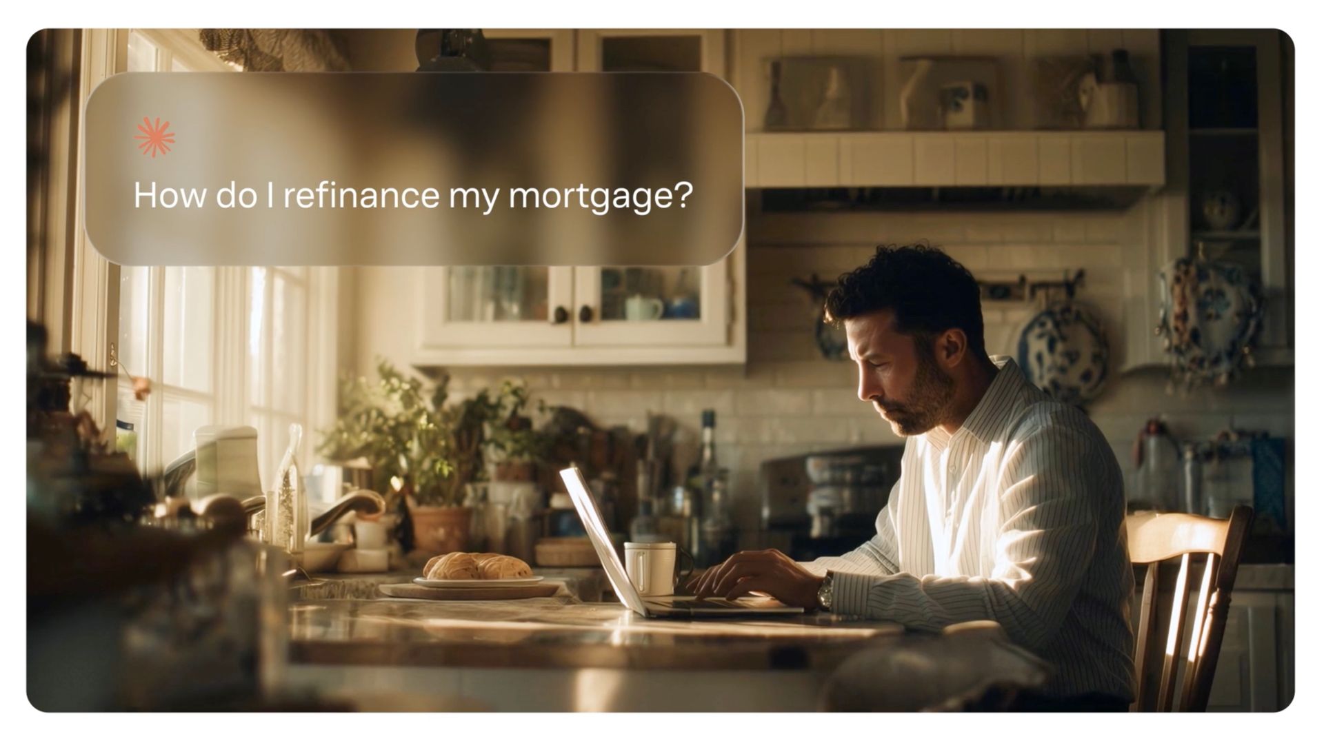Person working on a laptop at a kitchen table with the text, “How do I refinance my mortgage?”, from the Yext Be the Answer brand film.
