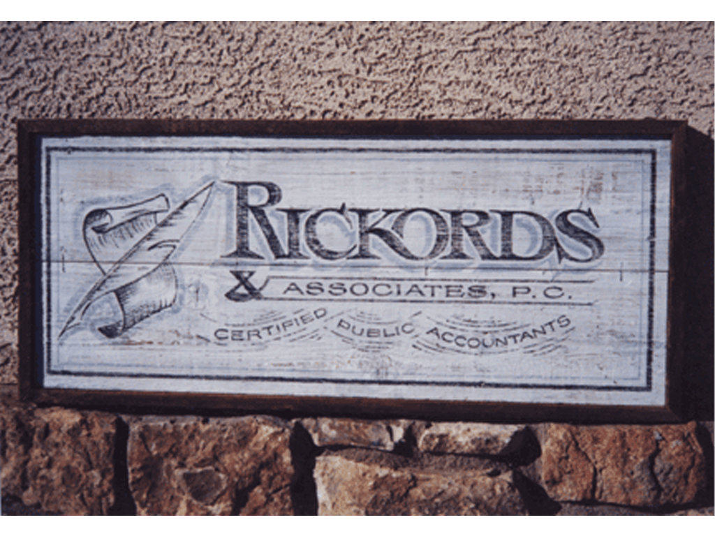 Distressed lettering on recycled wood
