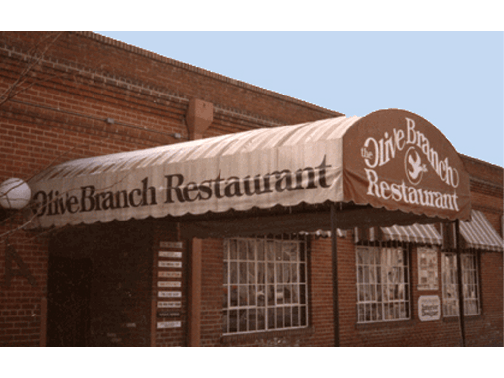 Storefront awning hand lettered on site