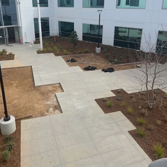 A large building with a patio in front of it