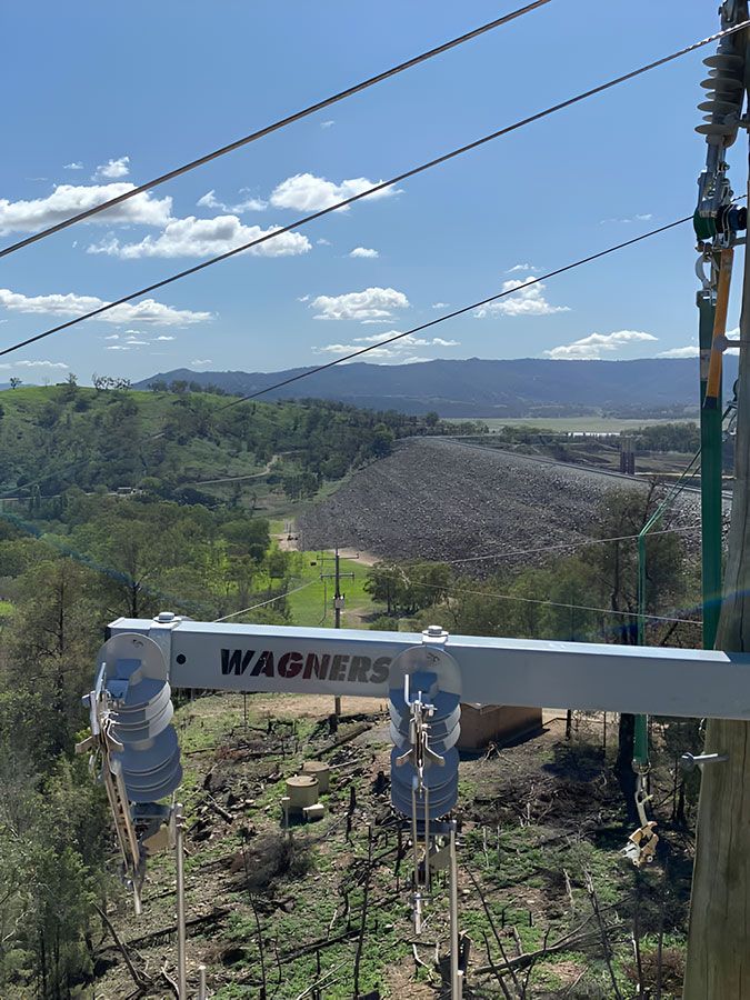 A Wagner Sign is Hanging From a Pole in the Middle of a Forest — Country Powerline Constructions in Young, NSW