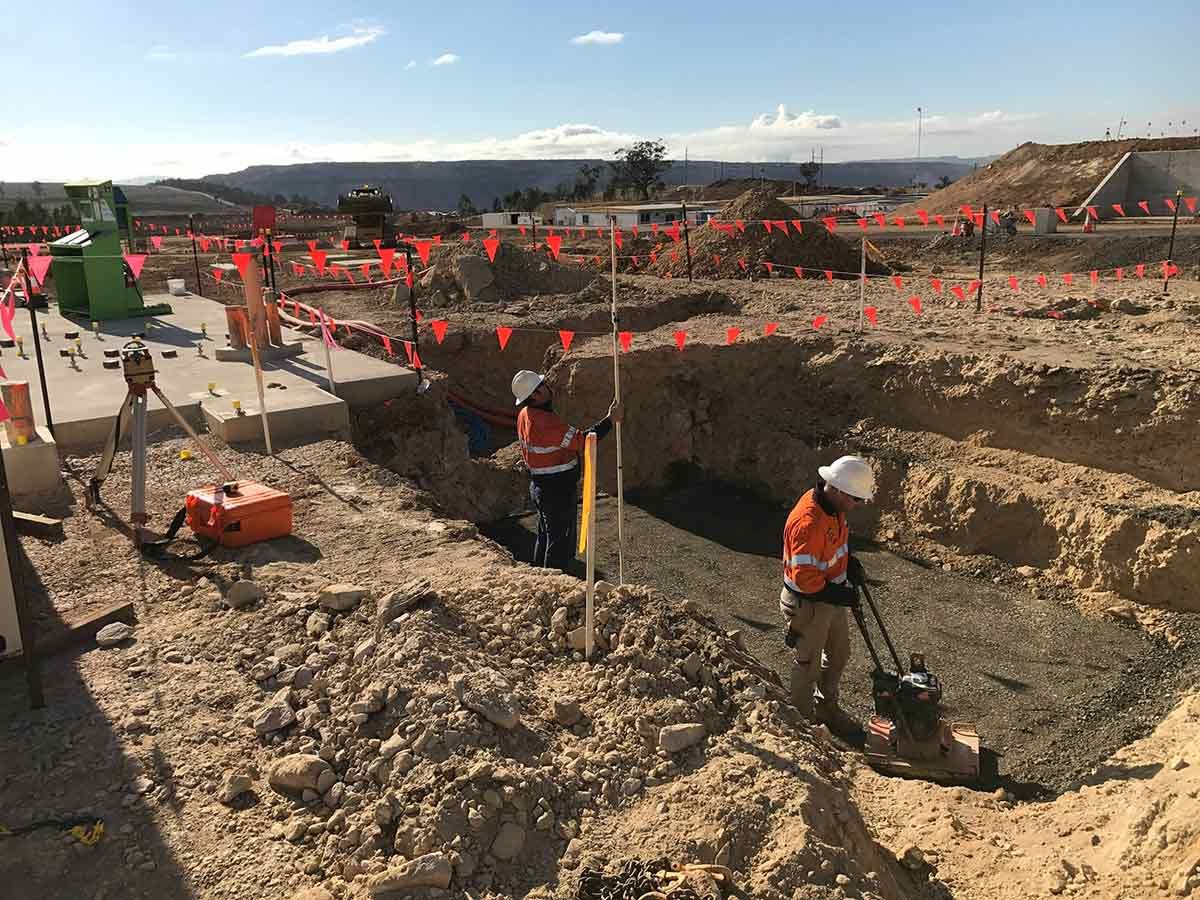 A Group of Construction Workers Are Working on a Construction Site — Country Powerline Constructions in Dubbo, NSW