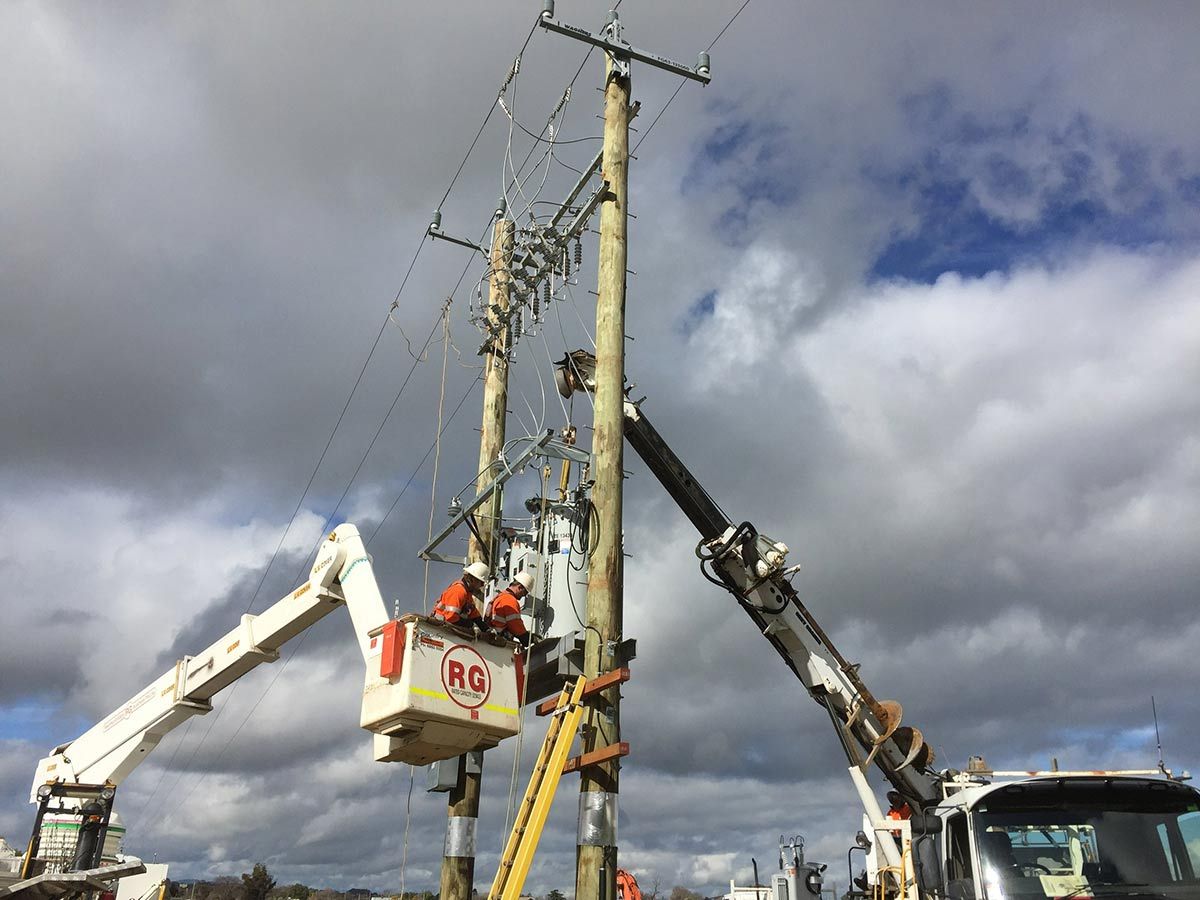 A Group of Workers Are Working on a Power Line — Country Powerline Constructions in Dubbo, NSW