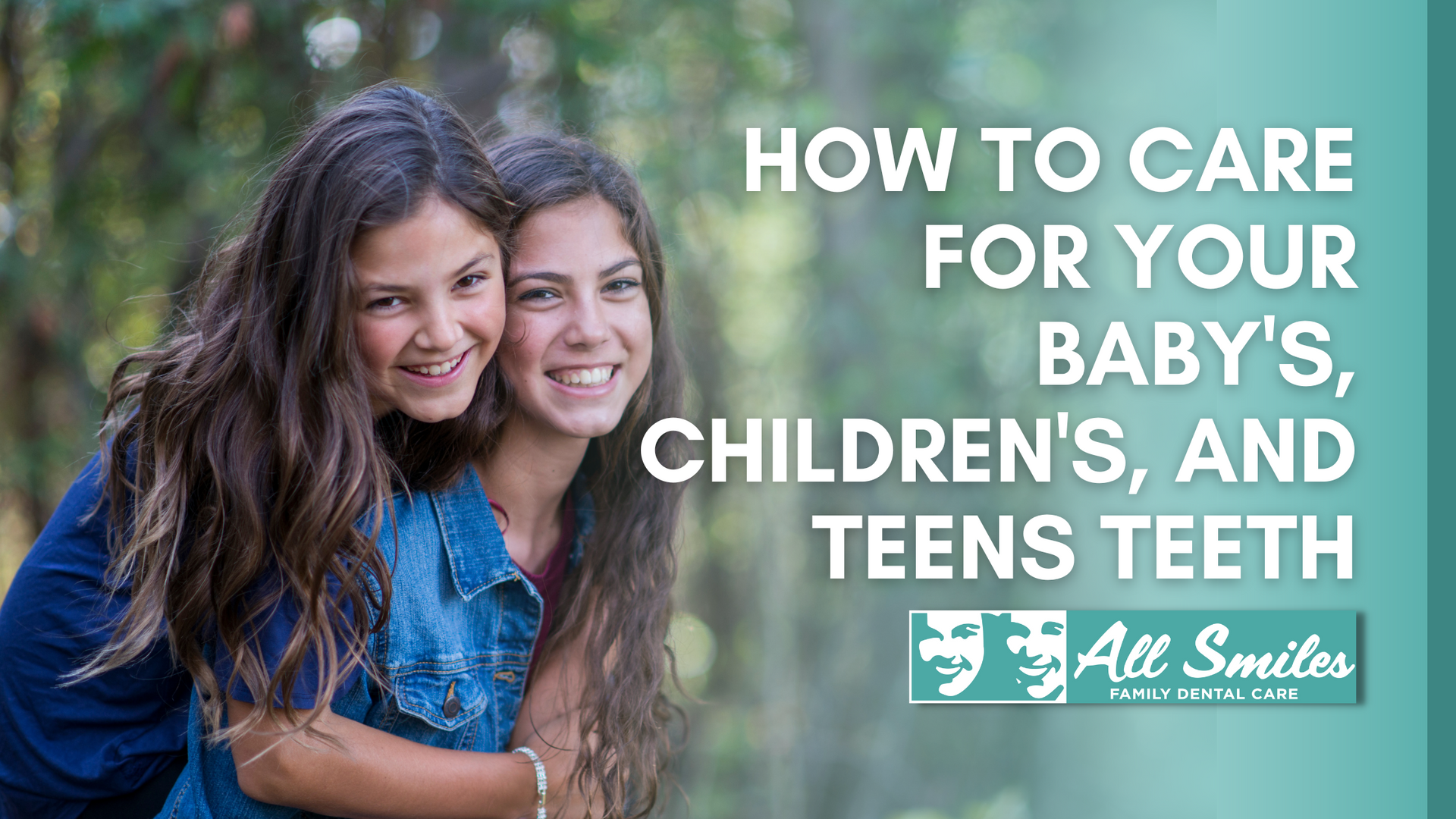 Two young girls are hugging each other and smiling.