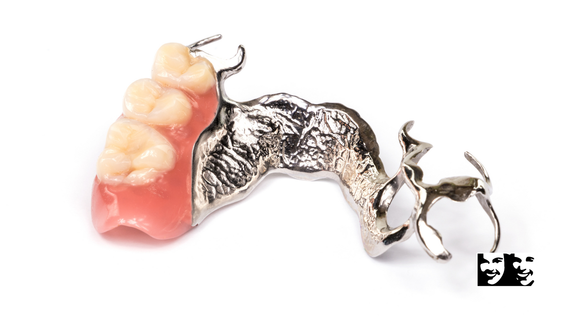 A close up of a dental prosthetic on a white background.
