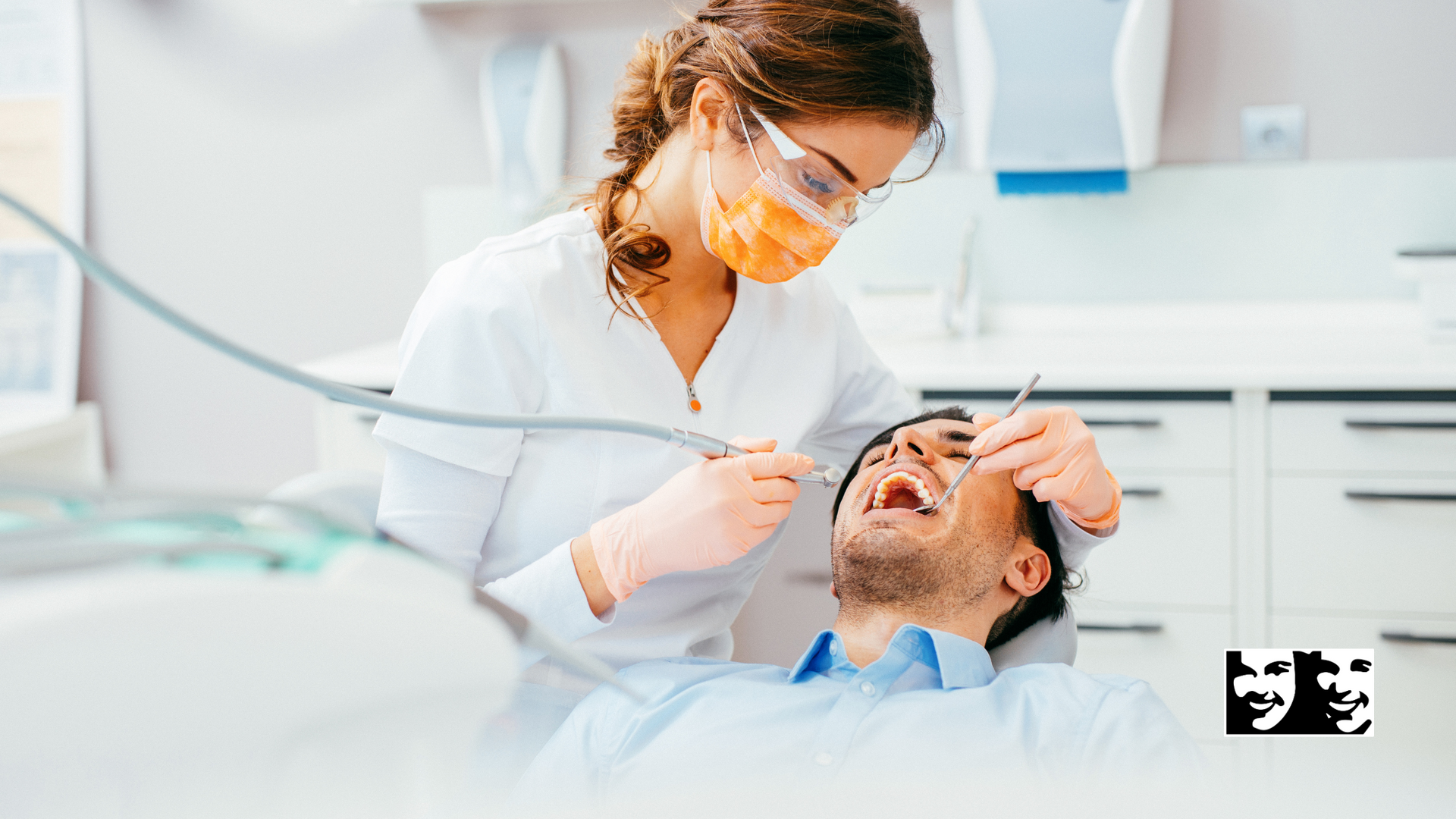 A female dentist is examining a man 's teeth in a dental office.