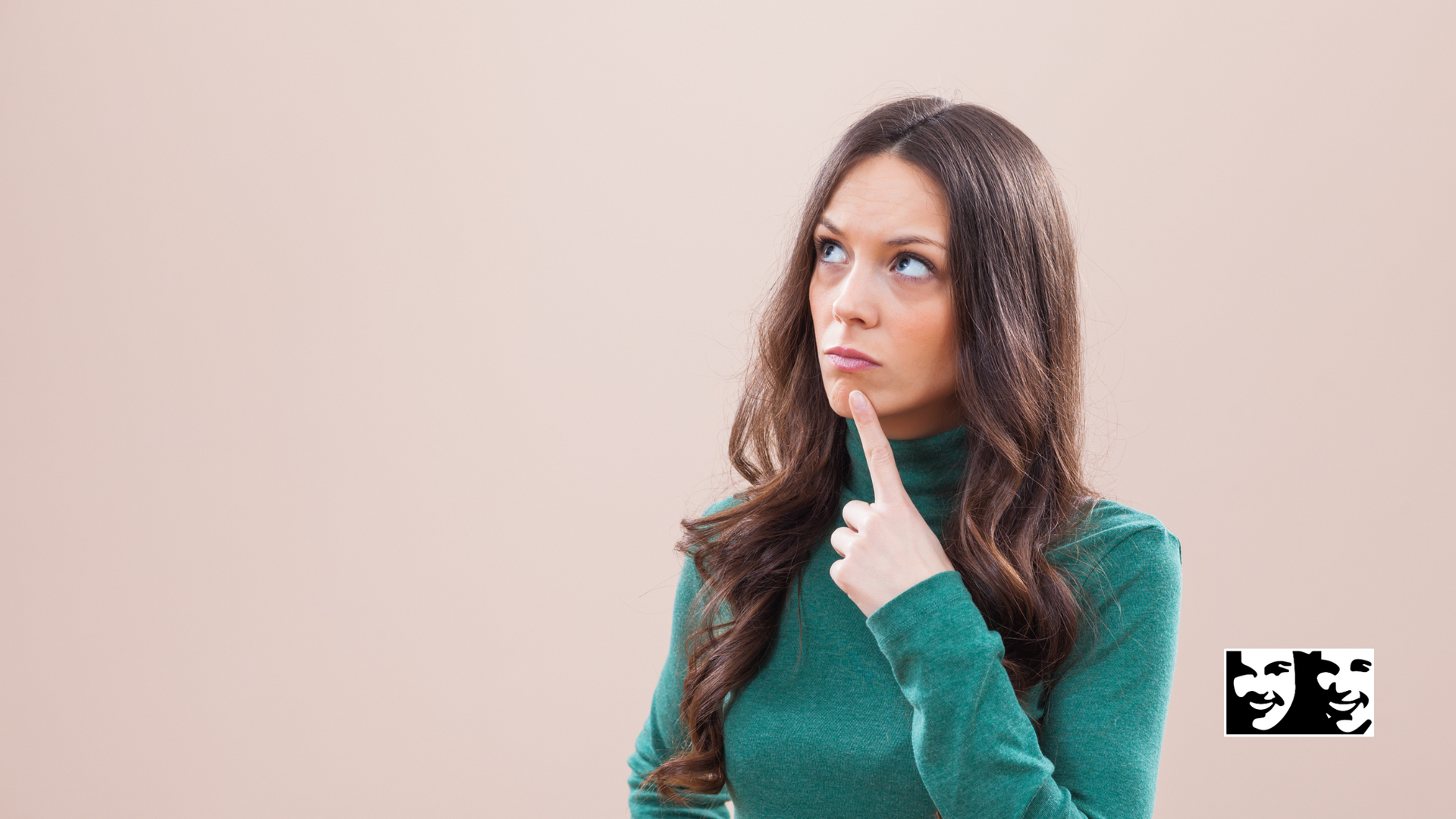 Woman with long brown hair, green turtleneck, thoughtful expression, finger on chin, looking upwards.