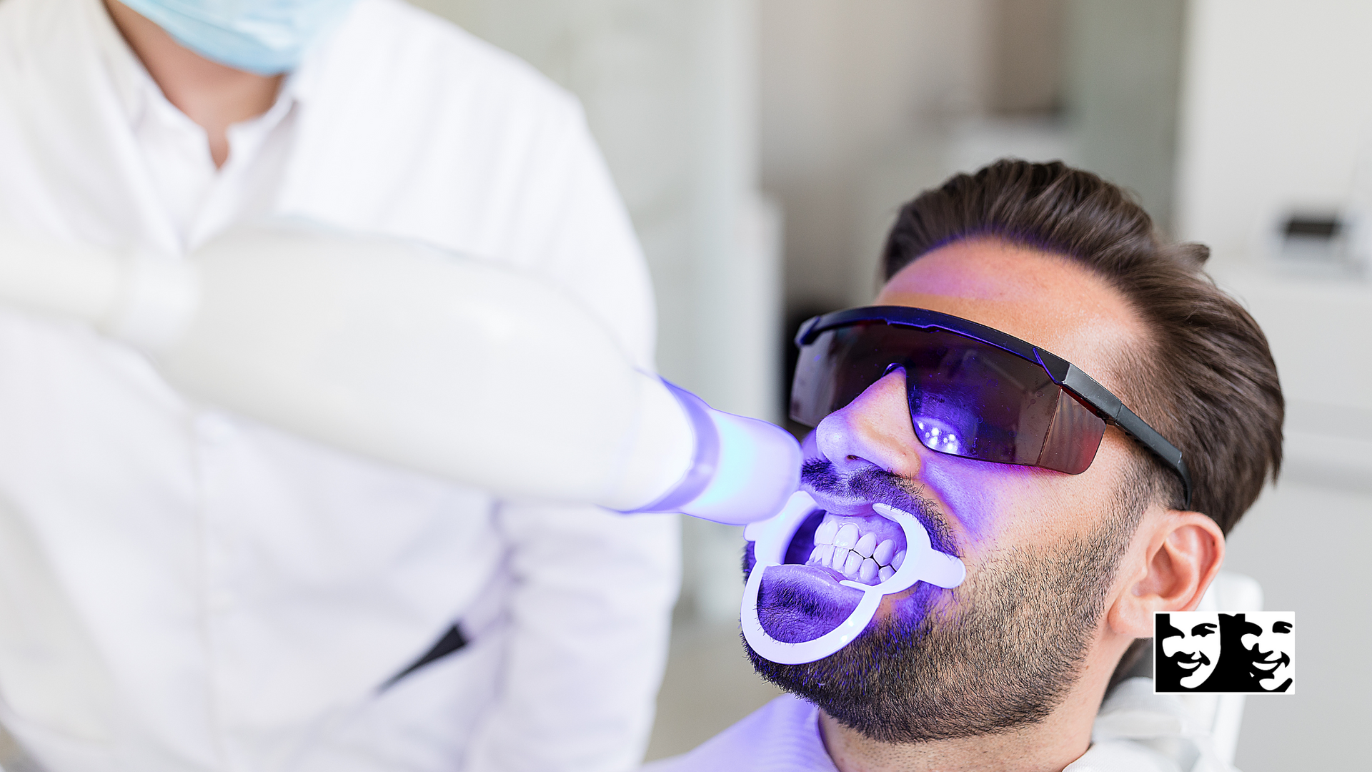 A man is getting his teeth whitened by a dentist.
