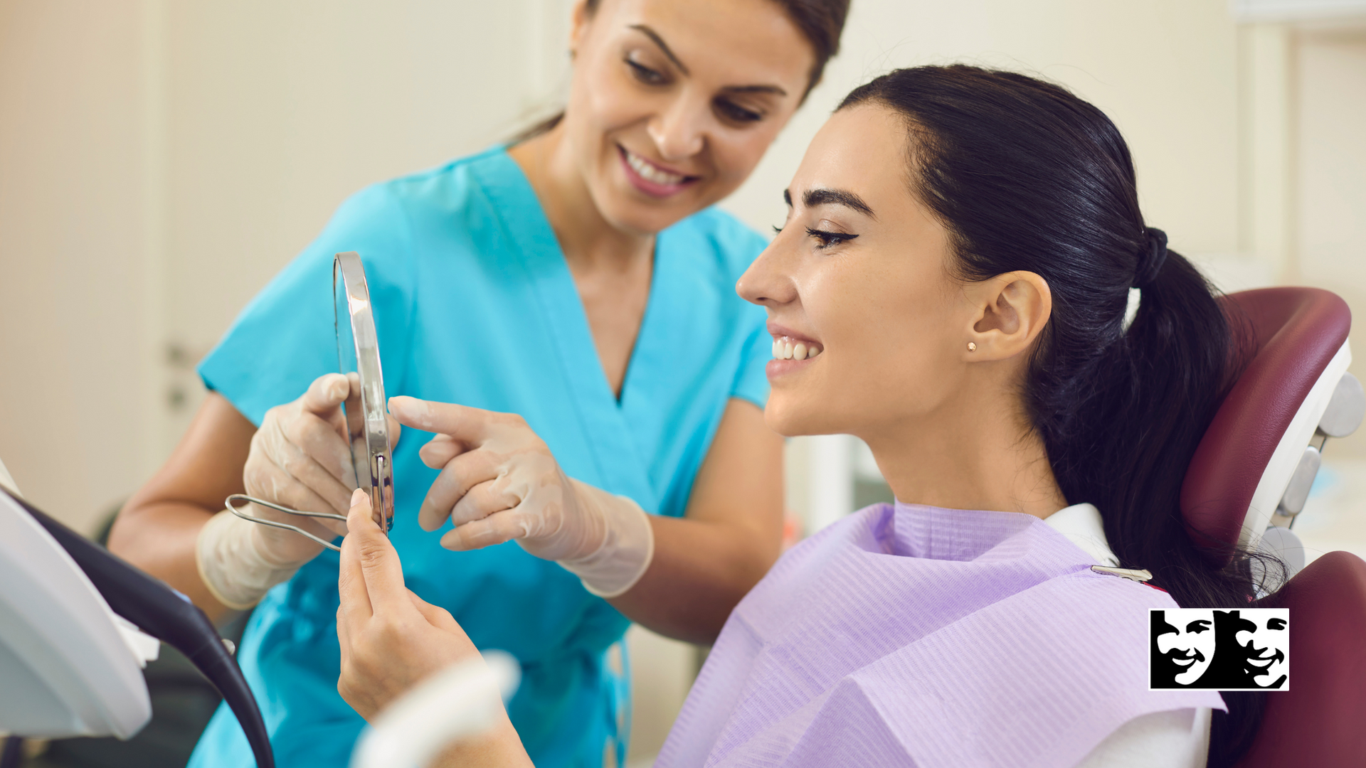 A woman is sitting in a dental chair while a dentist examines her teeth.