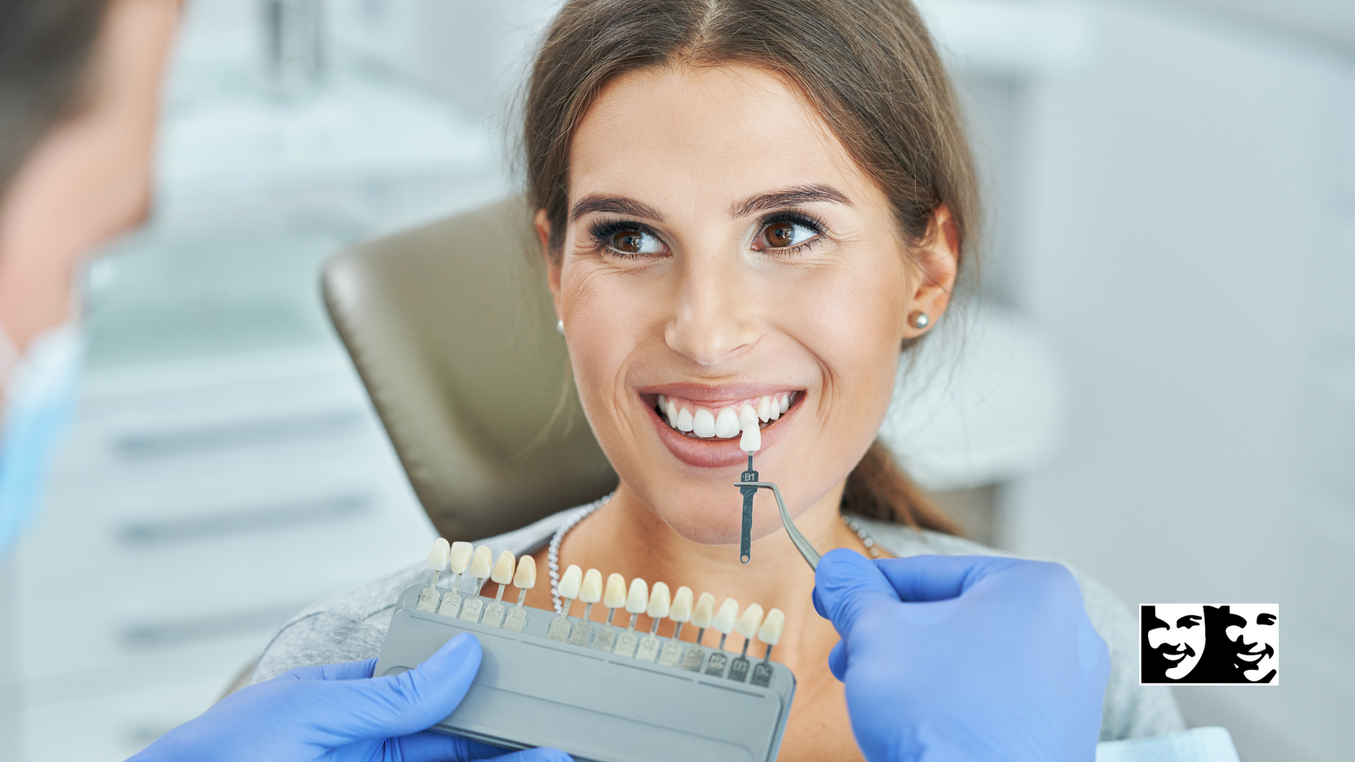 A woman is sitting in a dental chair while a dentist examines her teeth.