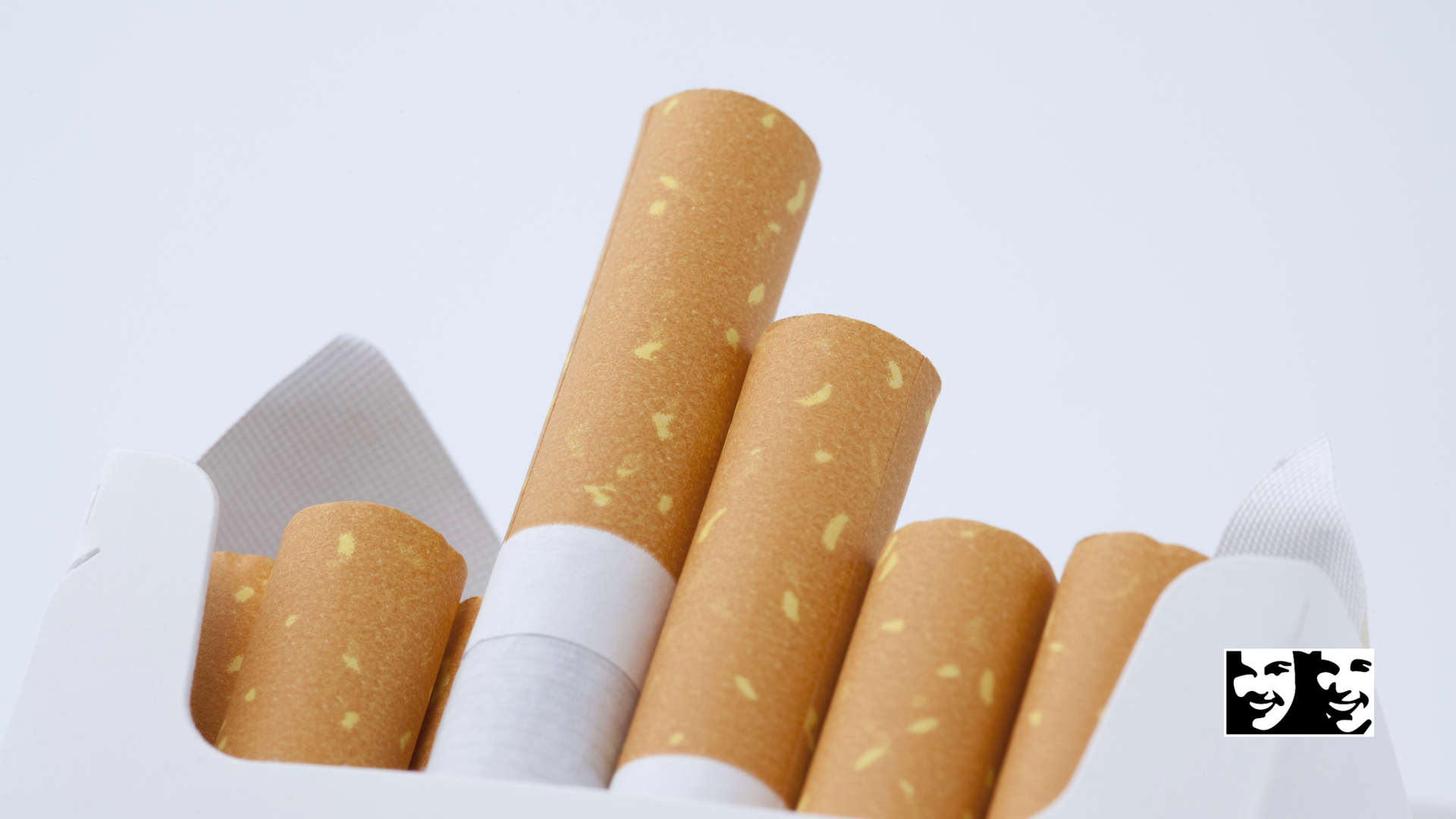 A pack of cigarettes is sitting on a white surface