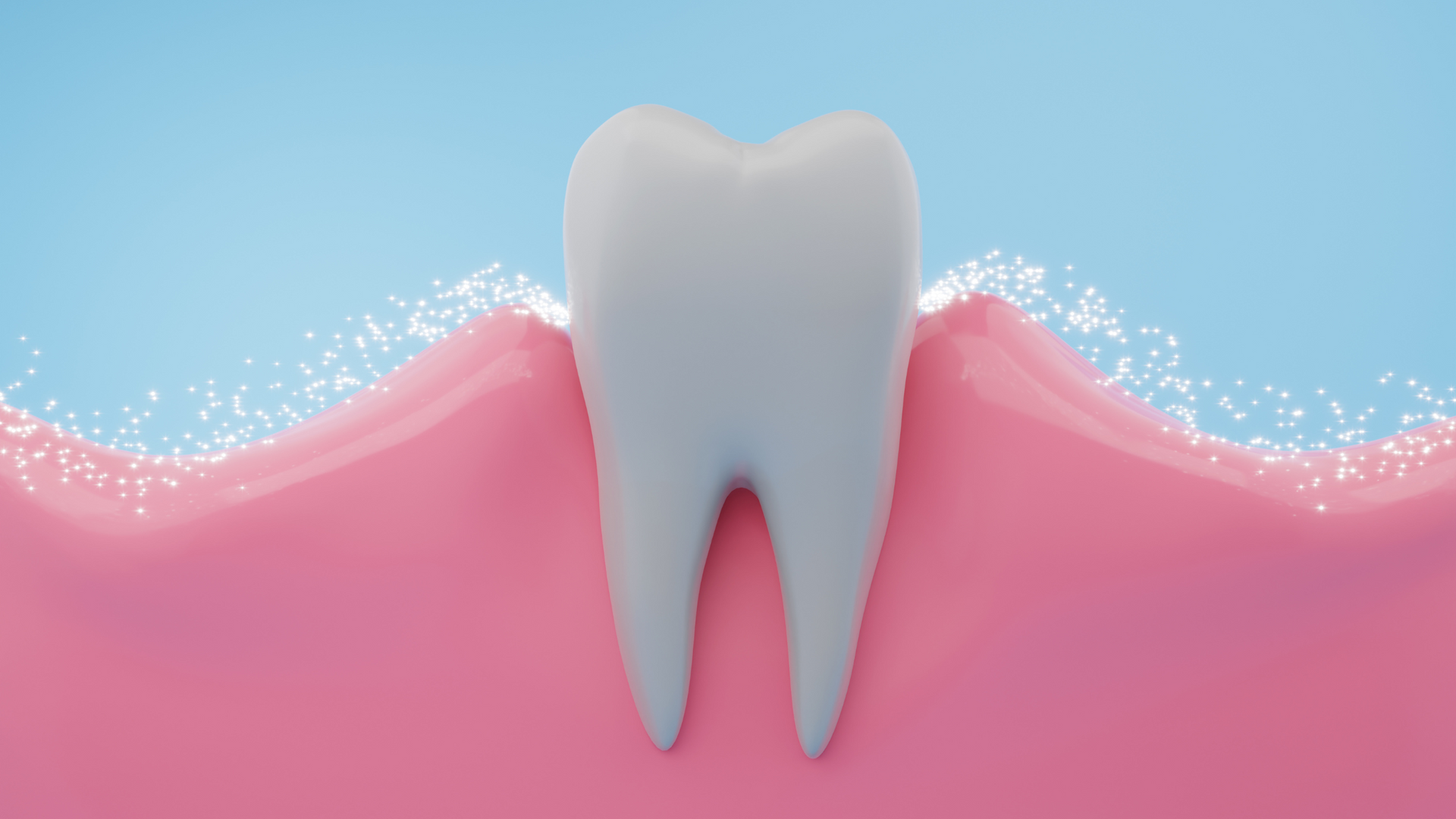 A tooth is sitting on top of a pink tooth.