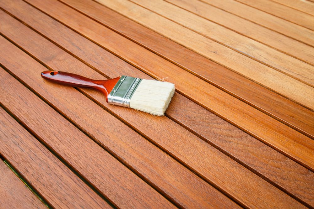A Brush is Sitting on Top of a Wooden Table — Timeless Painting In Umina Beach, NSW