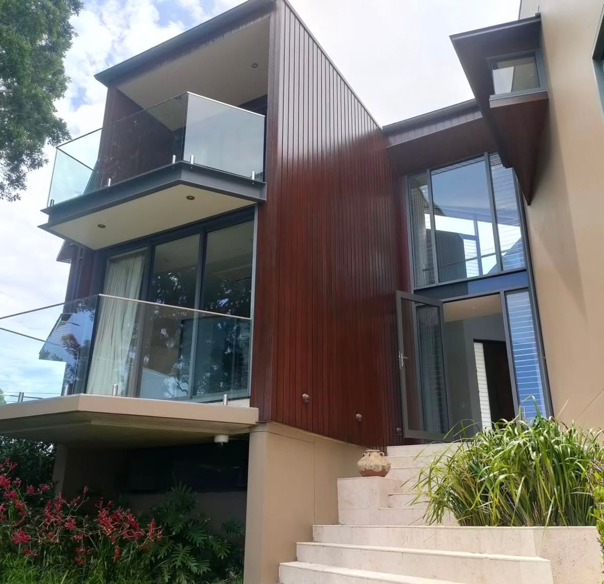 A House is Being Painted With Buckets of Paint in Front of It — Timeless Painting In Umina Beach, NSW