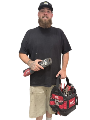 Man in black shirt and khaki shorts holding a power tool and a red tool bag on a white background