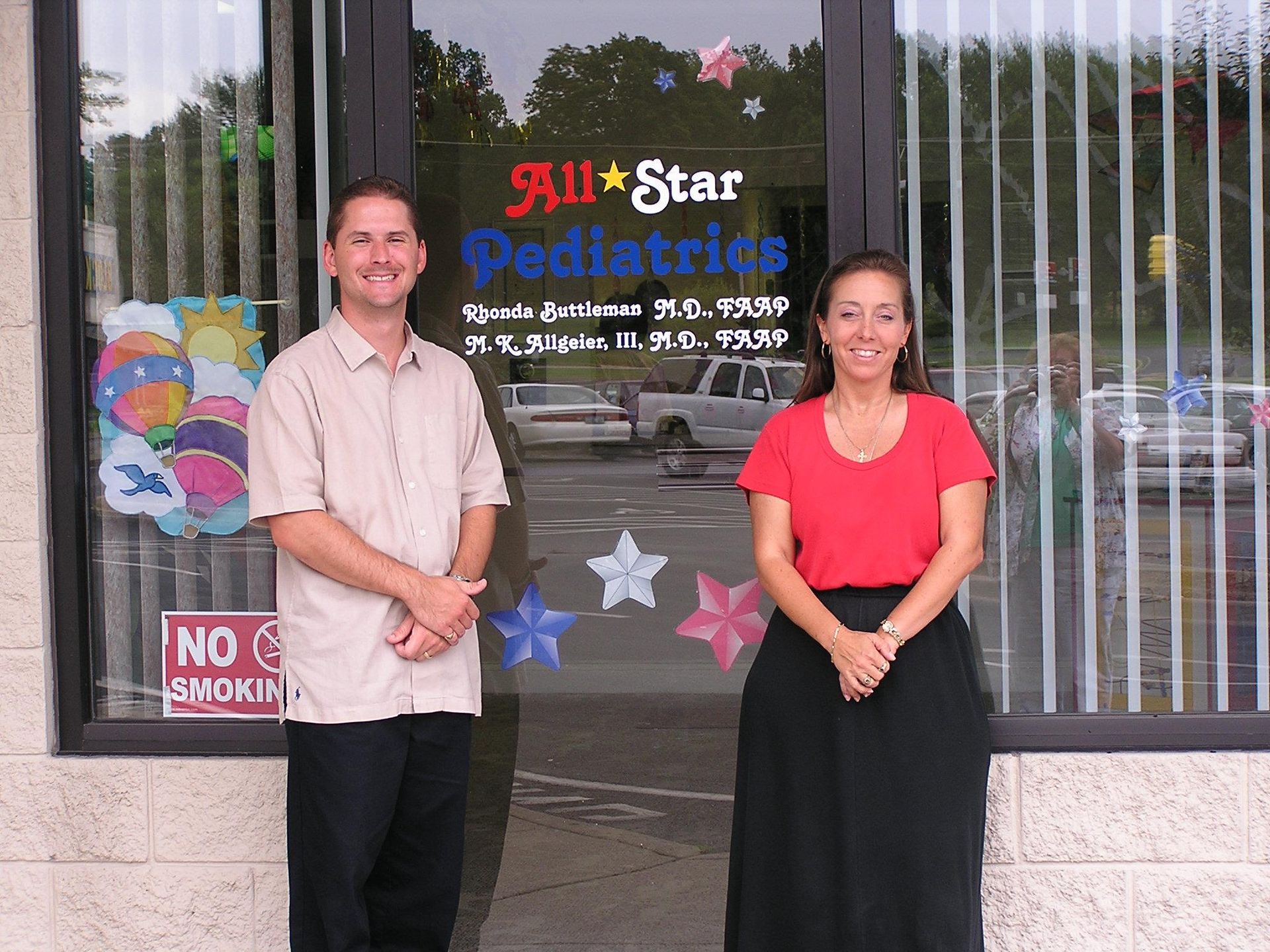 Two people stand in front of 