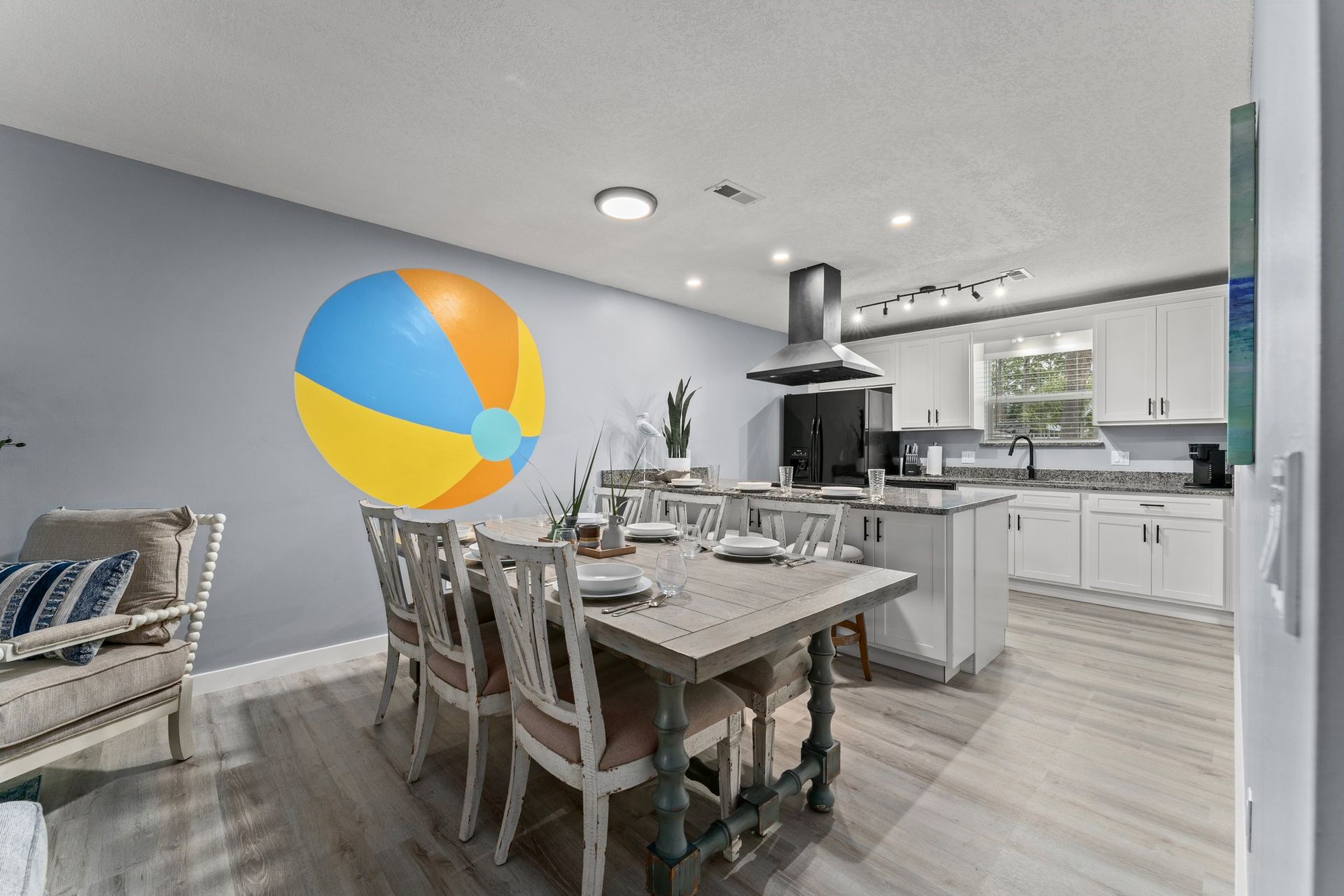 Modern dining room and kitchen with a beach ball on the floor