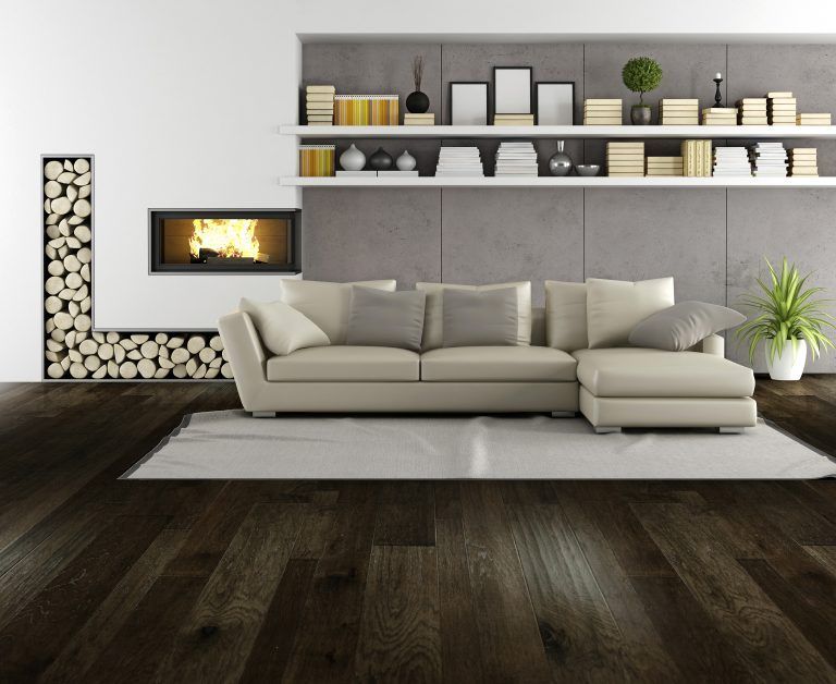A living room with a couch and a fireplace