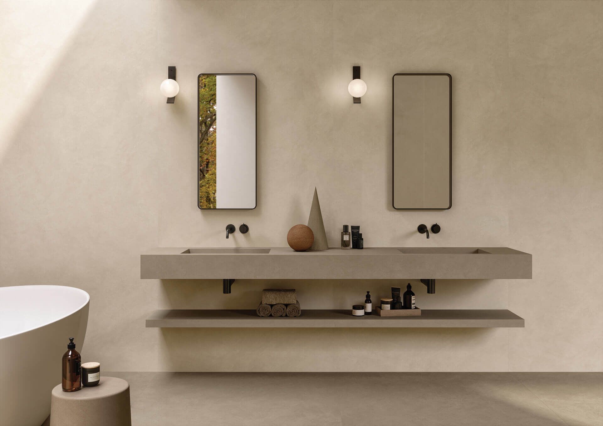 A bathroom with two sinks , two mirrors and a bathtub.