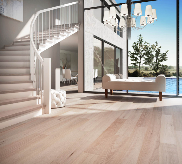 A living room with a curved staircase and a bench
