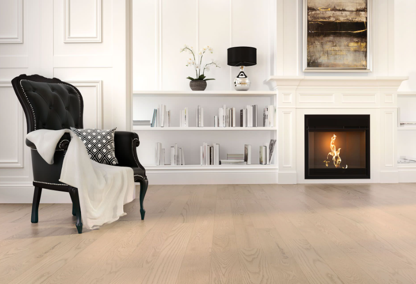 A living room with a fireplace and a chair.
