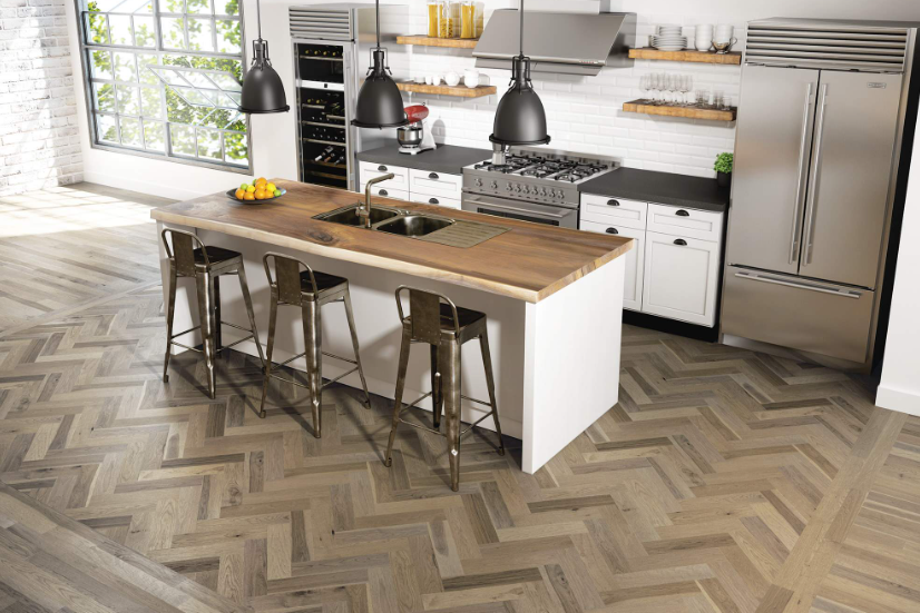 A kitchen with stainless steel appliances and a wooden counter top.