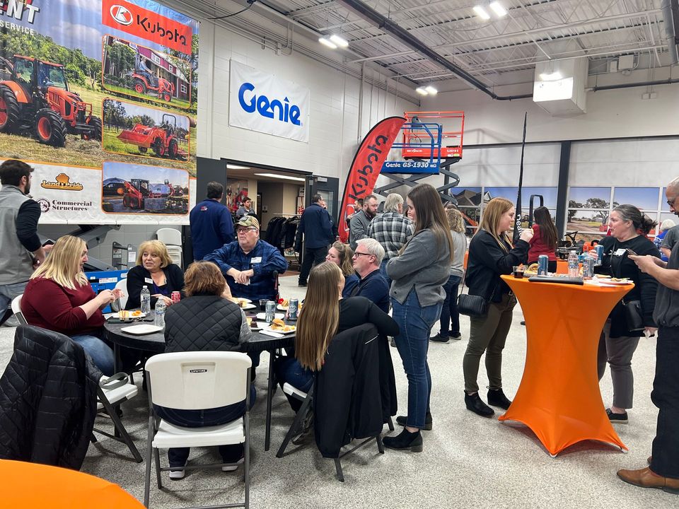 A group of people are sitting at tables in a room.