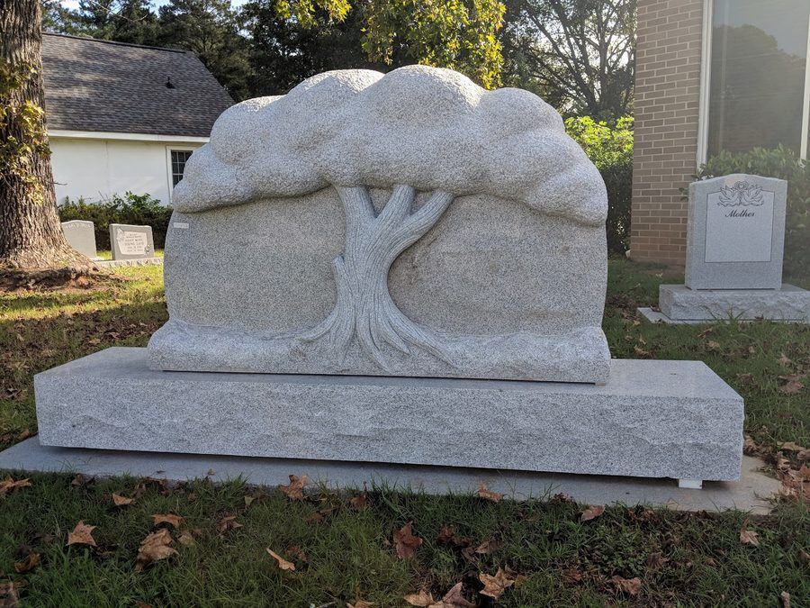 A granite monument carved in the shape of a tree, made at the Marion, NC shop