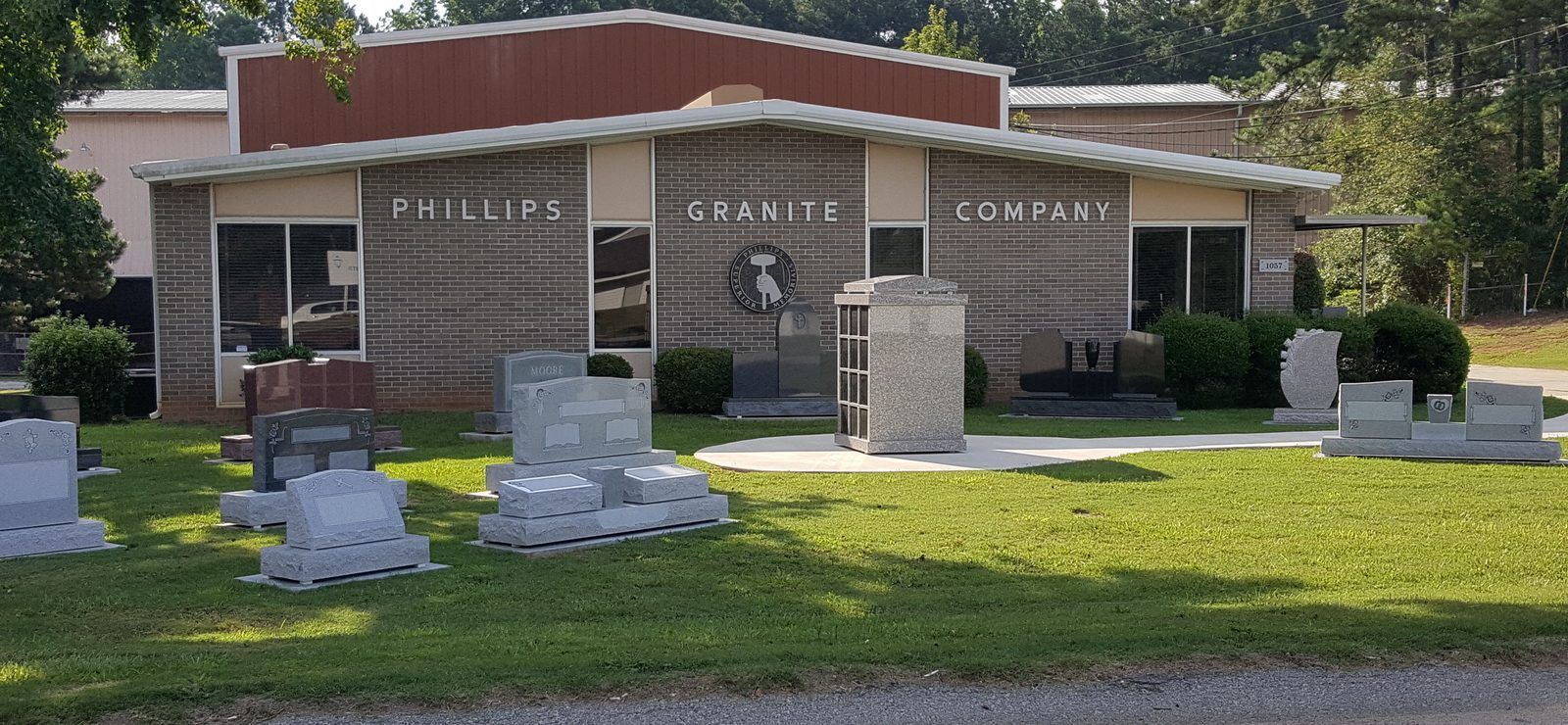 The Winnsboro, SC monument showroom on Columbia Road, with granite monuments and a columbarium on the lawn in front of the building